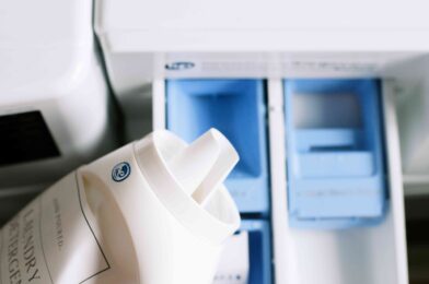 Where does the liquid detergent go in a top load washing machine?